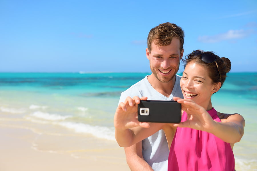 Couple taking a photo with smartphone 