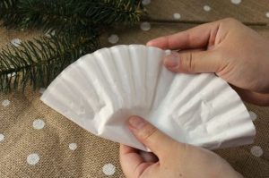 This DIY Hometalk user makes a Christmas tree ornament out of coffee filters. Courtesy