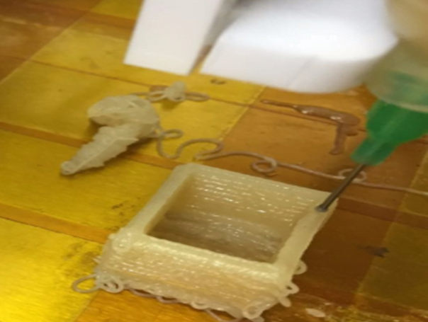 A researcher presents the 3D printing of dough in a presentation, courtesy