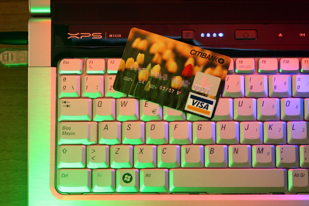 An illustrative photo of a credit card on a laptop. Photo by Jorge Franganillo on Flickr