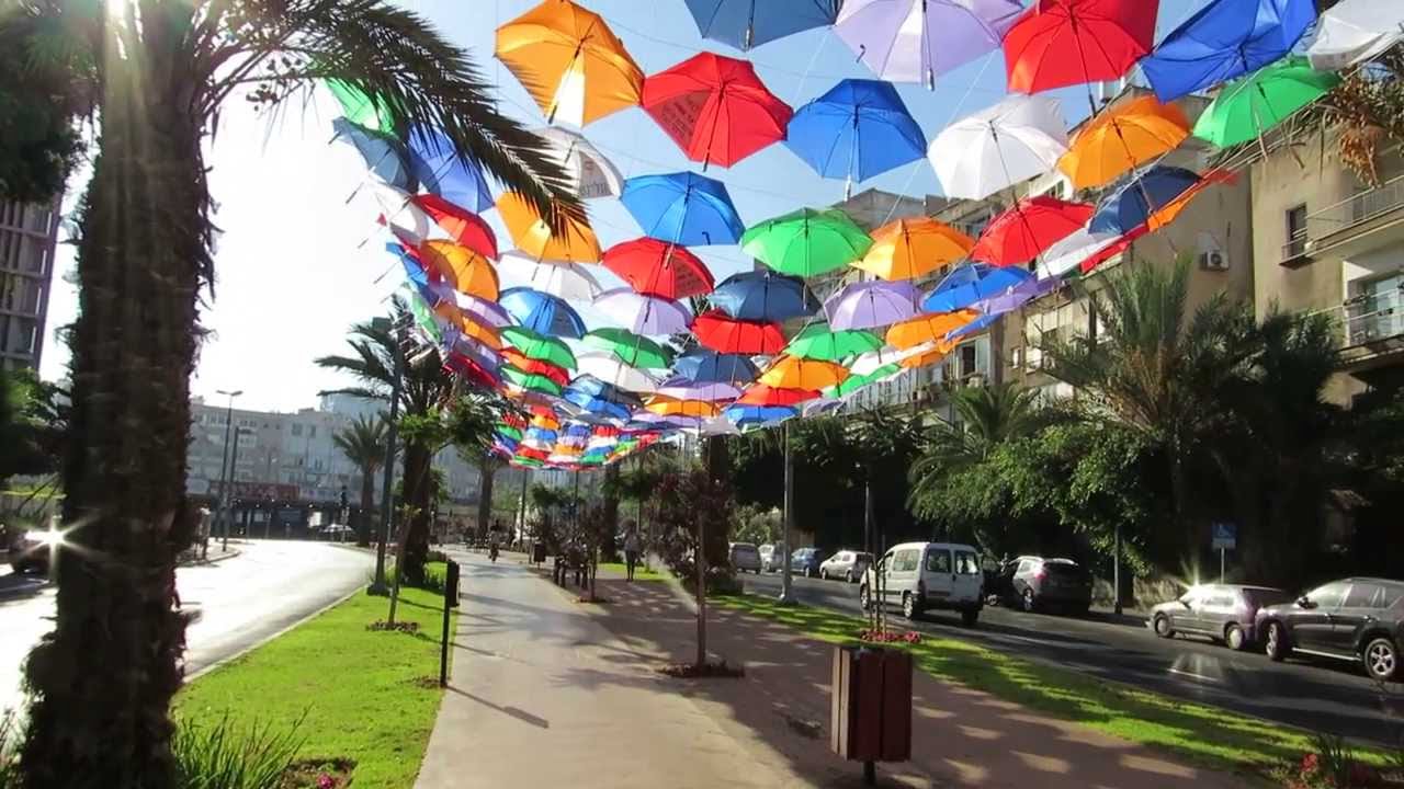 Six hundred colorful umbrellas once decorated Rothschild Boulevard in a temporary exhibit to announce the "Wi-Fi cloud" in 2013. Photo via YouTube.
