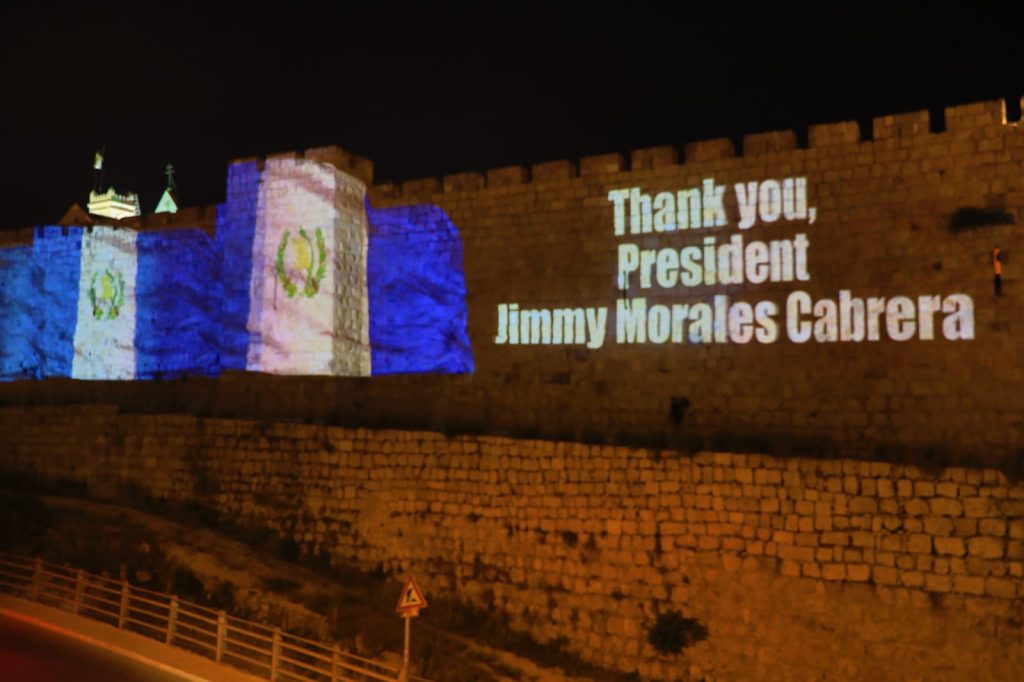 Th walls of the Old City of Jerusalem illuminated with the Guatemalan flag. Photo by Sasson Tiram via the GPO