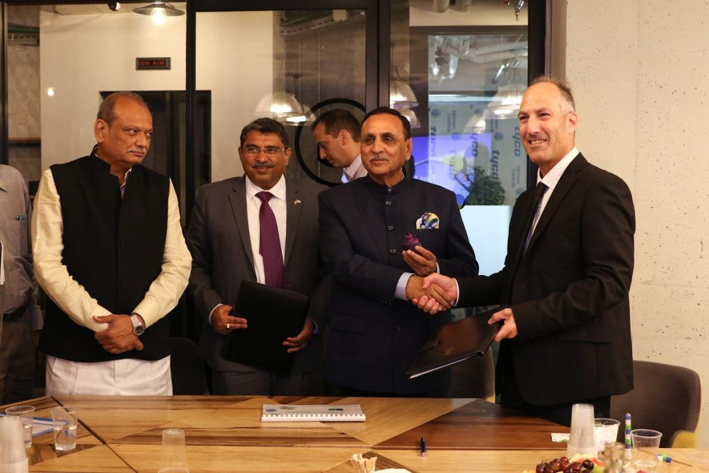 Biofeed's Dr. Nimrod Israely signs an MOU with the chief minister of the Indian state of Gujarat, Vijay Rupani, in July 2018. Courtesy
