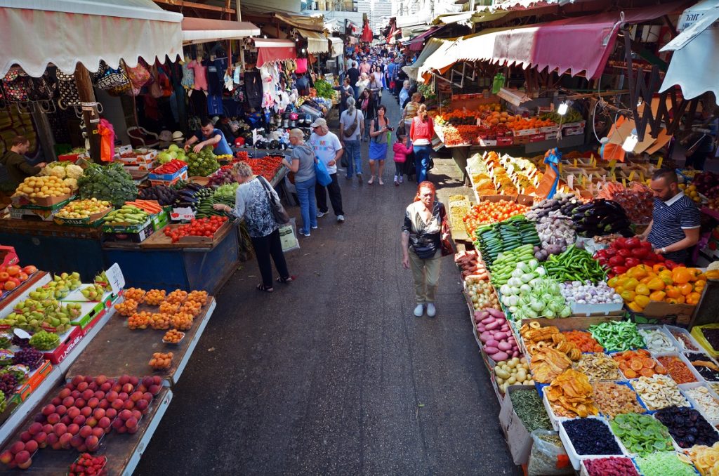 Shoppers at Shuk HaCarmel in Tel Aviv. Deposit Photos