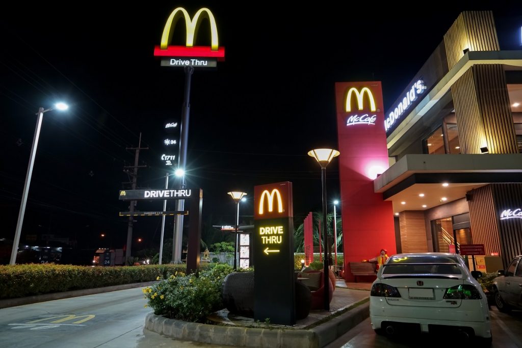 A McDonald's restaurant and drive thru service in Thailand.  Deposit Photos