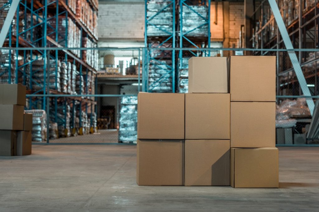 An illustrative photo of packages in a warehouse. Deposit Photos