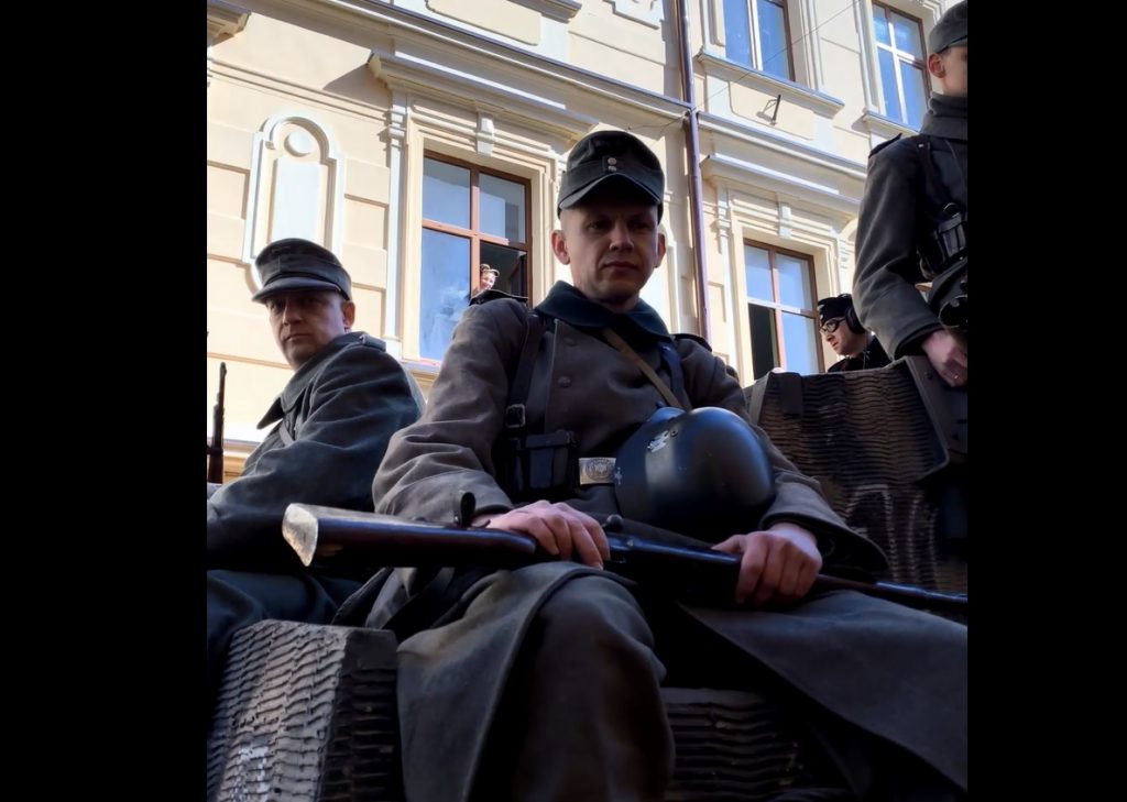 A screenshot from Eva Stories showing actors playing invading Nazi forces.
