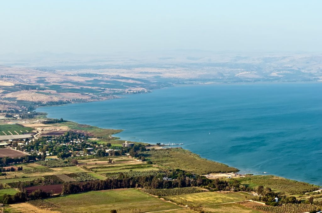 View of the Sea of Galilee in the summer . Deposit Photos