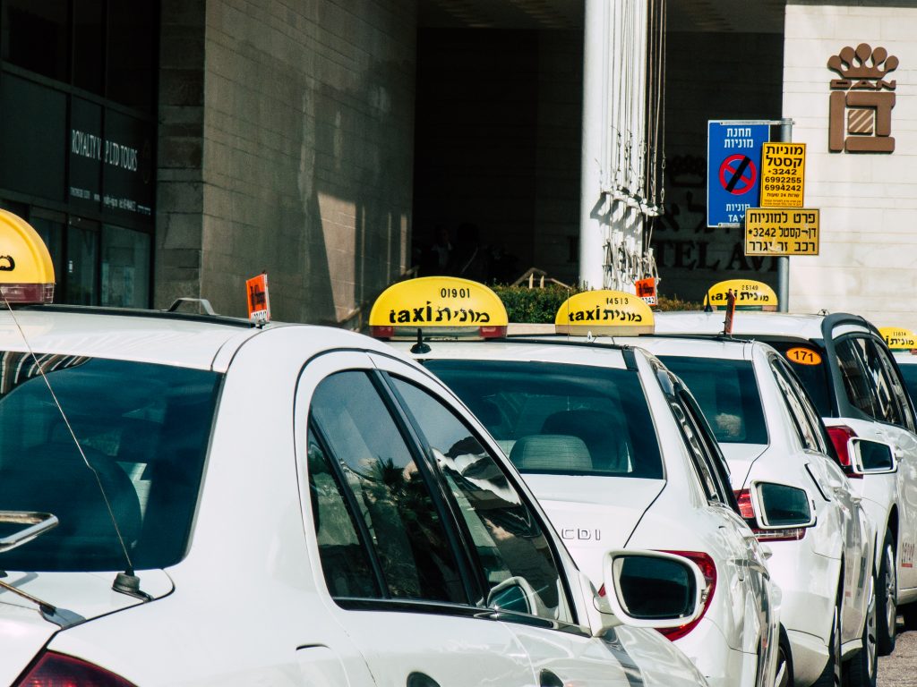 A row of traditional Israeli taxis. Deposit Photos