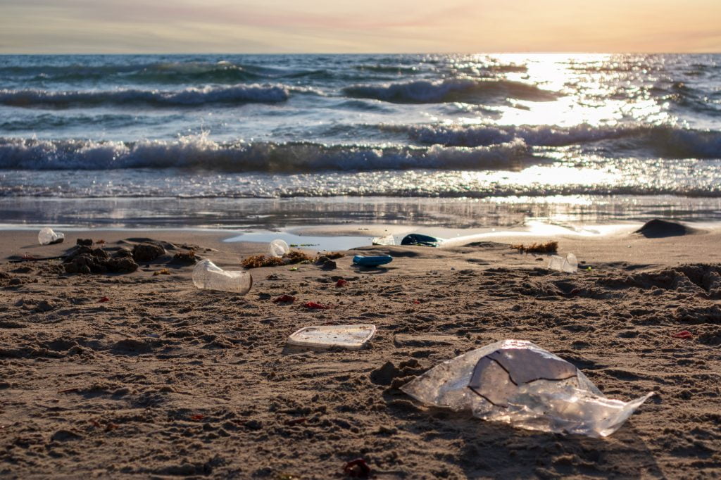 Plastic trash on the beach in Israel.  Deposit Photos