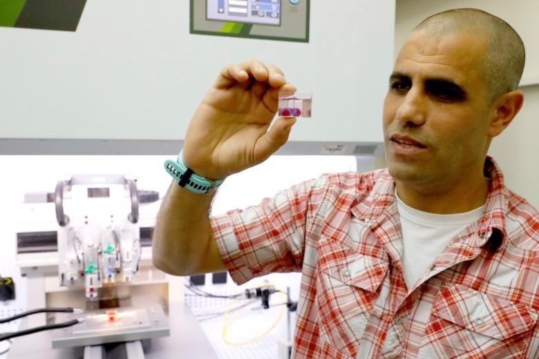 Screenshot of Professor Tal Dvir holding a miniature 3D heart.