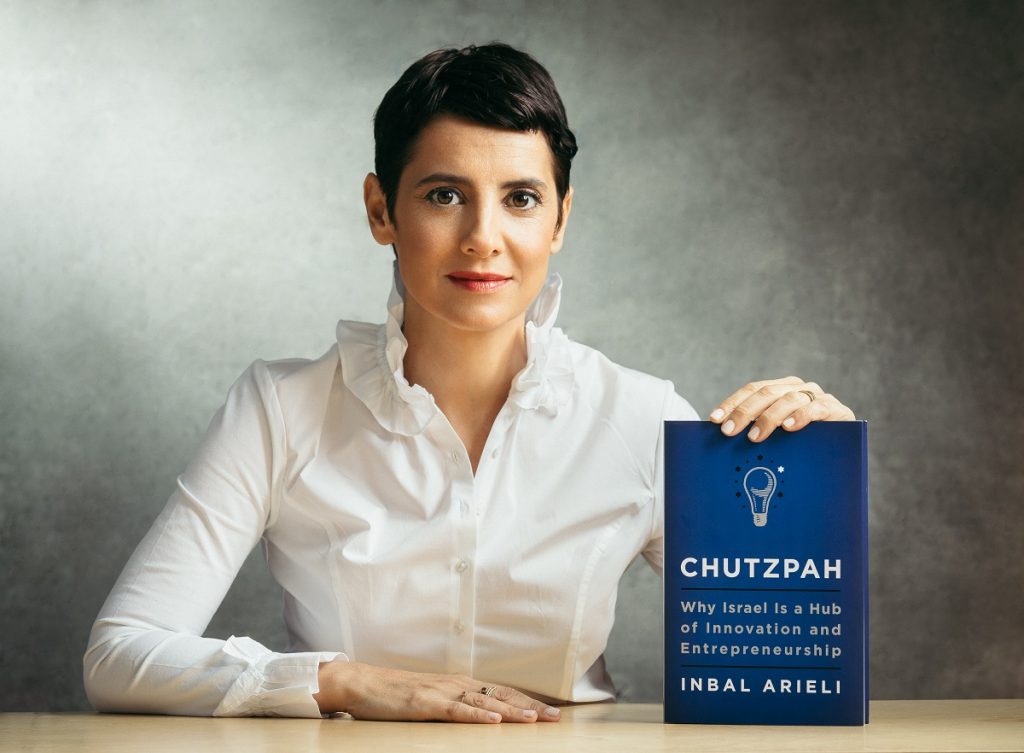 Inbal Arieli with her book 'Chutzpah: Why Israel Is a Hub of Innovation and Entrepreneurship.' Photo by Micha