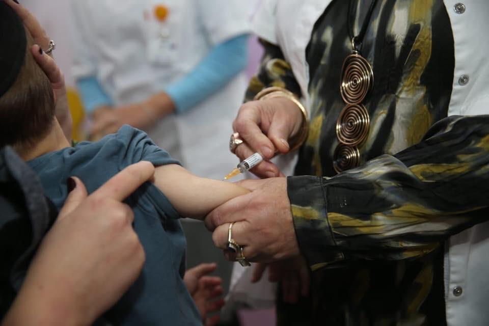 An illustrative photo of a nurse administering a flu vaccine. Photo via the Israeli Health Ministry