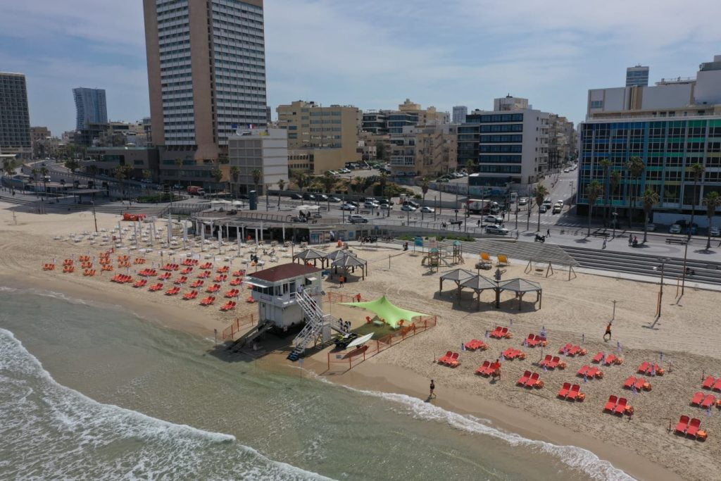A Tel Aviv beach puts seating at least two meters apart in line with social distancing rules. Photo: Ilan Spira