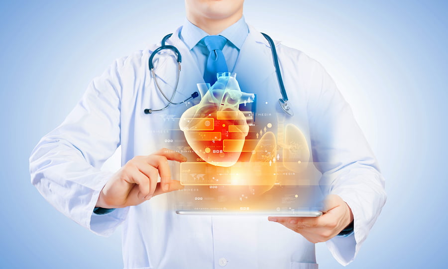Close up of doctor's body holding tablet pc with media illustration via BigStock