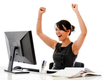 Successful business woman with arms up via Rocio Lara/Flickr