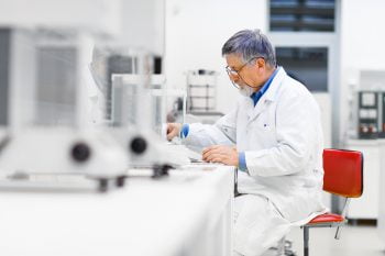 Senior male researcher carrying out scientific research in a lab (shallow DOF; color toned image) via Bigstock