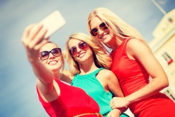Young women with smartphone camera