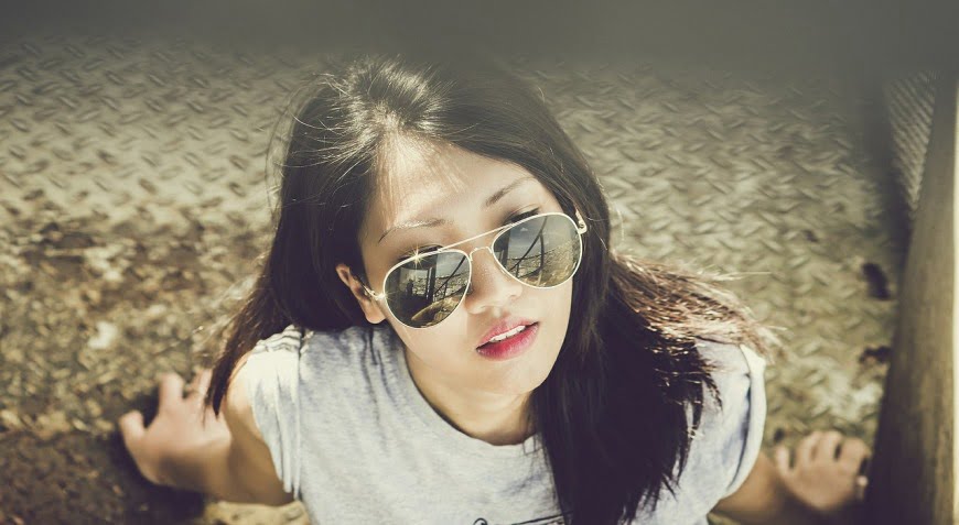 young Chinese woman with sunglasses. Courtesy