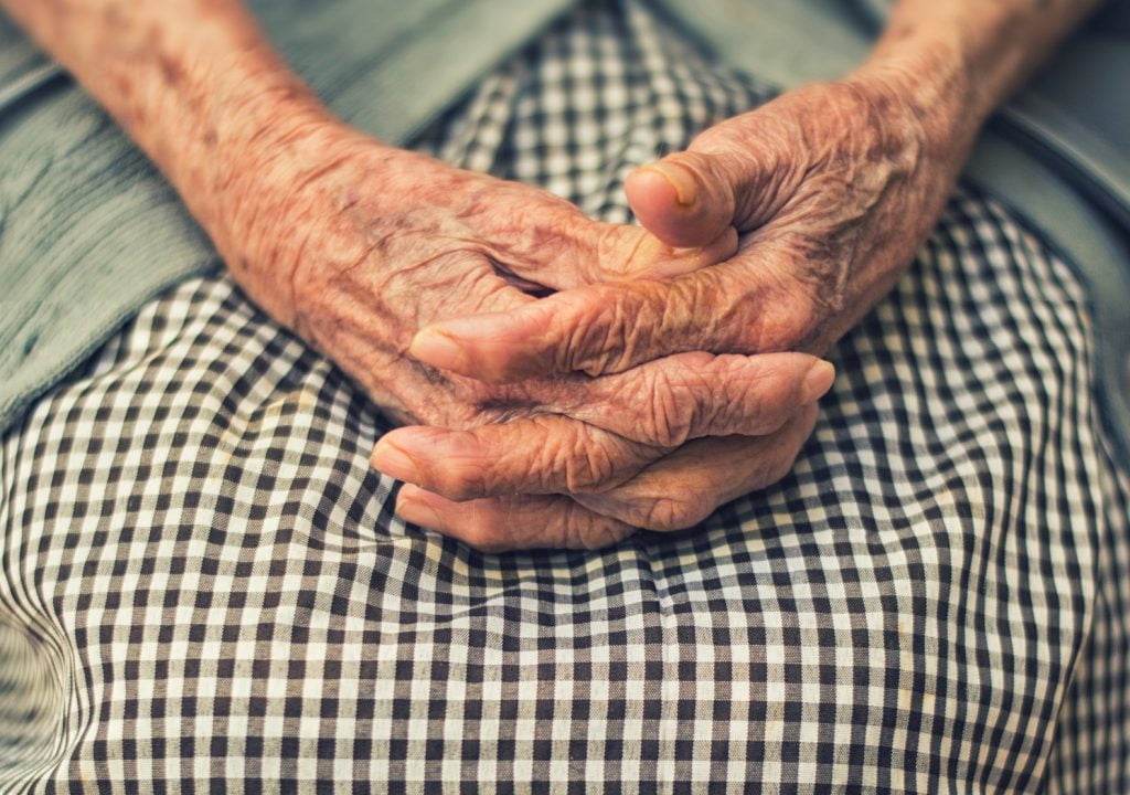 An illustrative photo of an elderly woman's hands. Photo by Cristian Newman on Unsplash