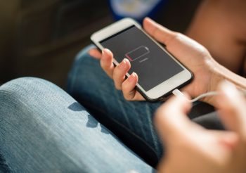 An illustrative photo of an iPhone charging. Photo by rawpixel.com on Unsplash