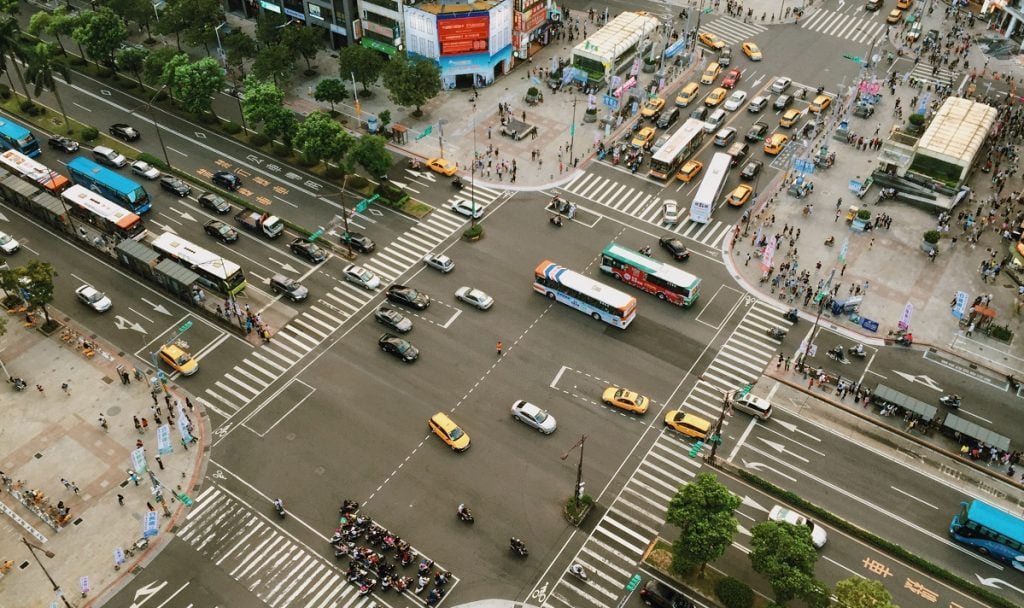 Aerial view of traffic in an unnamed Asian city. Photo by Pexels