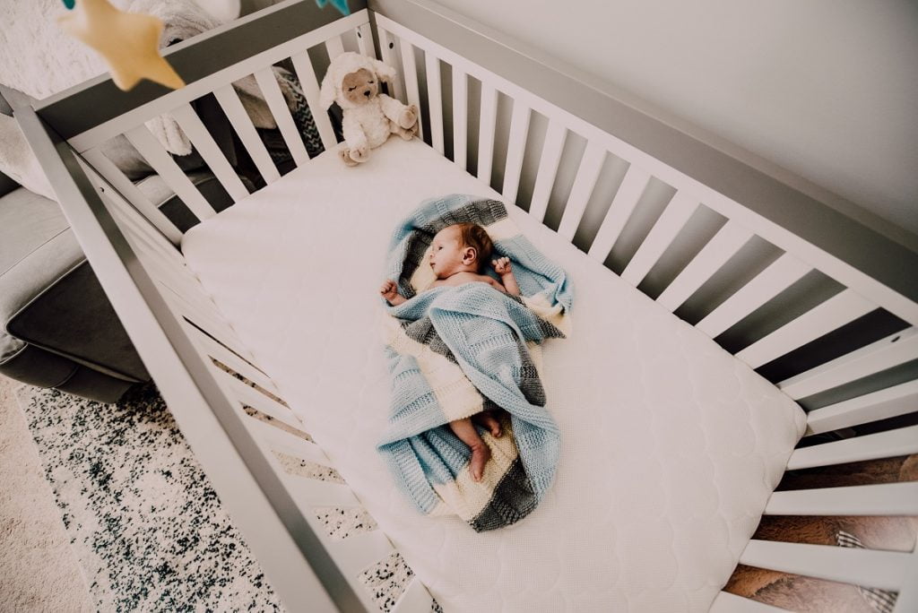 A baby in a crib. Photo by Pexels