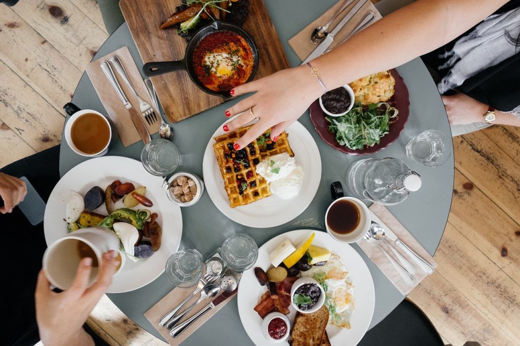 An illustrative photo of a table of food. Photo via Pixabay