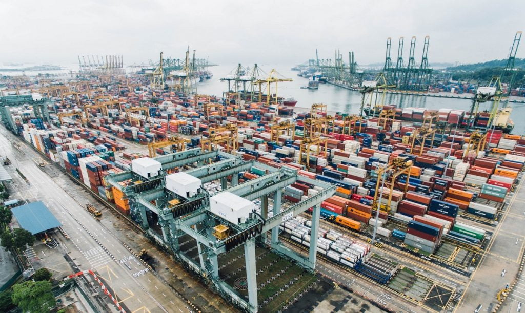 A cargo port in Singapore. Photo by chuttersnap on Unsplash