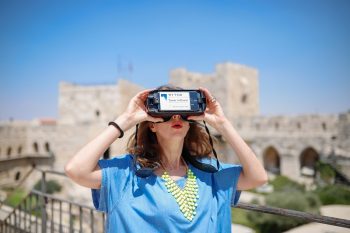 A visitor taking part in the Step Into History VR tours produced by the Tower of David Museum and Lithodomos VR. Photo by Ricky Rachman