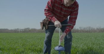 A farmer installs the CropX sensor. Courtesy