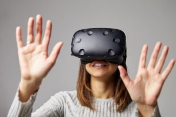Illustrative: A women with a VR headset. Deposit Photos