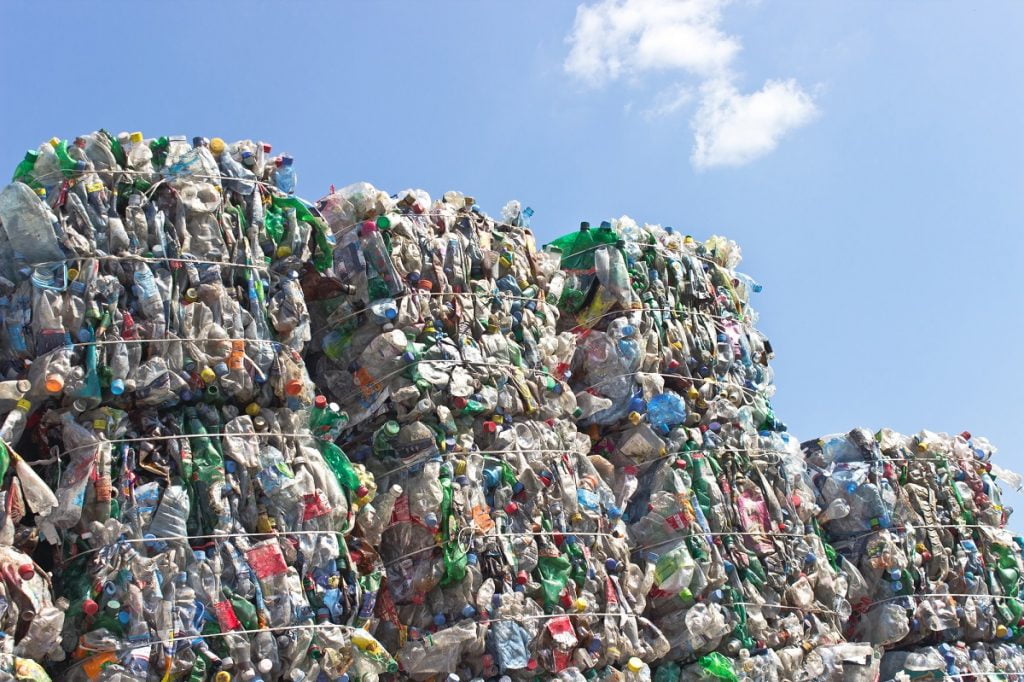 Stacks of plastic bottles for recycling. Deposit Photos