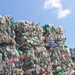 Stacks of plastic bottles for recycling. Deposit Photos
