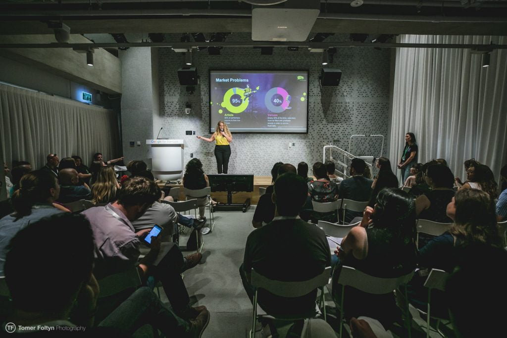 Keren Shany, founder, presents her startup FanFund at the WOSNA Demo Day. Photo by Tomer Foltyn