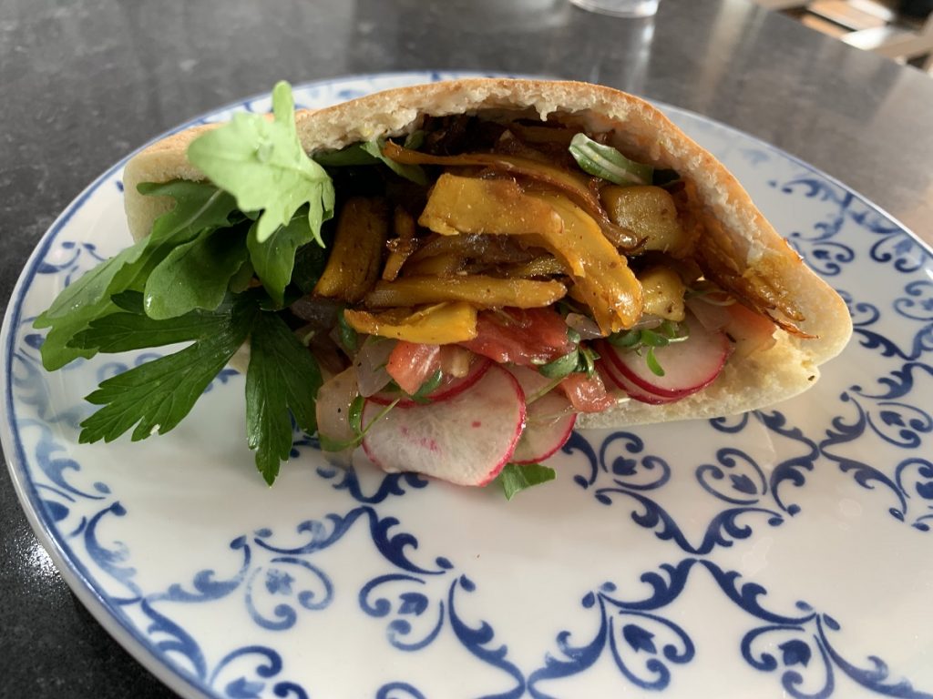 Future Meat's cultured chicken shawarma with extruded soy protein and cultured chicken fat combined with parsley and radish salad in warm pita bread. Photo: Dudi Moskovitz