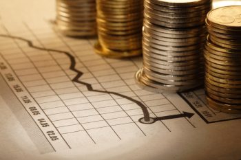 Illustrative. Coins on a chart. Deposit Photos