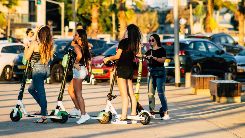 Scooter riders in Tel Aviv. October 2019. Deposit Photos