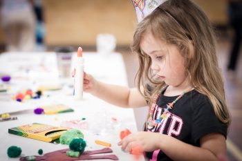 An illustrtative photo of a child making crafts. Deposit Photos