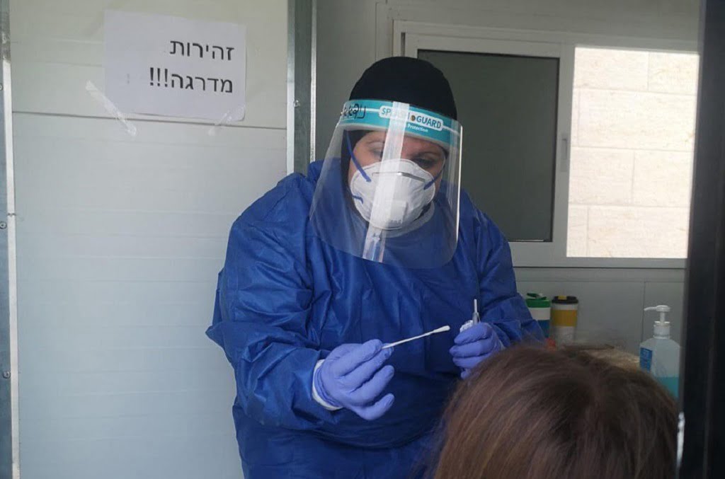 A coronavirus test administered by a Clalit healthcare worker in Petah Tikva, June 2020. Photo via the Health Ministry's Telegram channel.