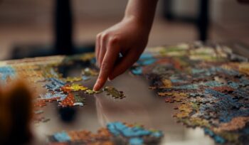 Jigsaw puzzles are a favorite pastime during the holidays. Photo: Ross Sneddon on Unsplash