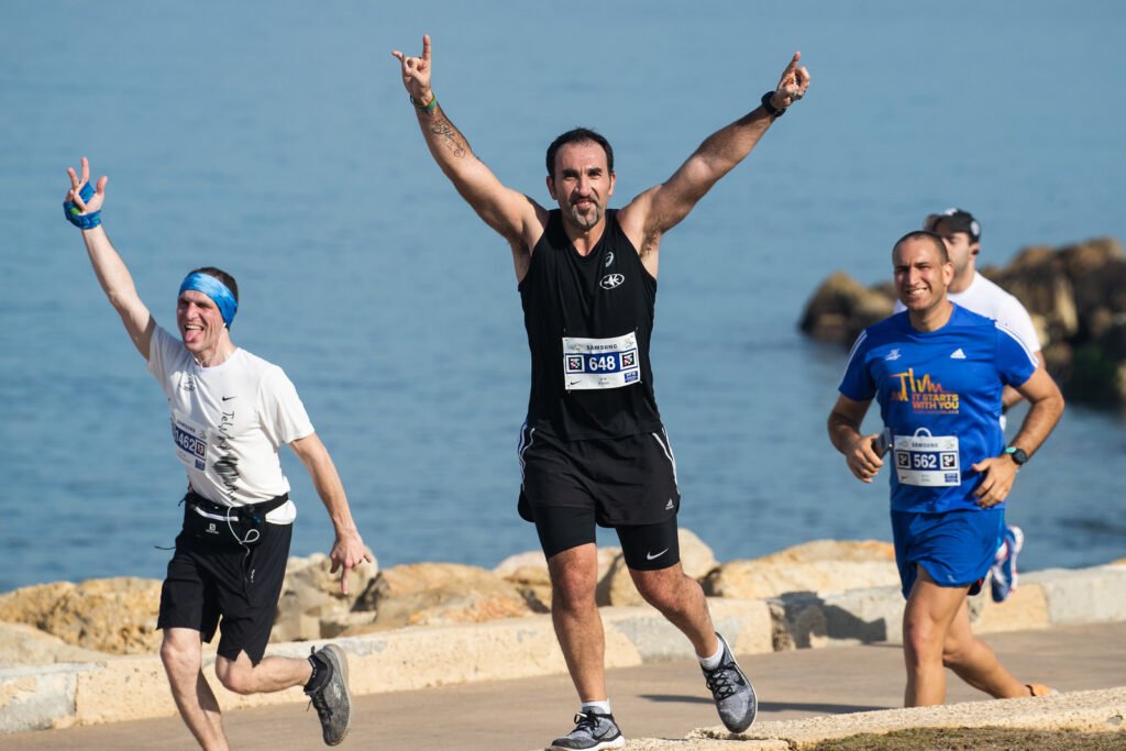 A runner cheers at Tel Aviv's 2020  marathon last year. Photo: Kapaim Active