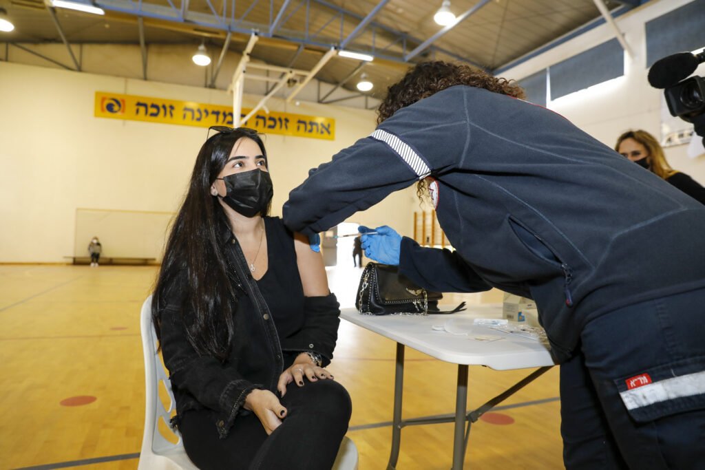 A Tel Aviv resident receives a COVID-19 vaccine. Photo: Guy Yechiely/ Tel Aviv Municipality