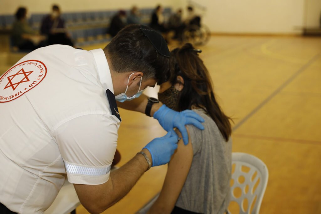 A Tel Aviv resident receives a COVID-19 vaccine. Photo: Guy Yechiely/ Tel Aviv Municipality