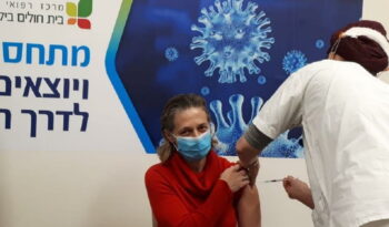 Dr. Sharon Alroy-Preis, head of public health services at the Israeli Health Ministry gets her second Pfizer/BioNtech vaccine dose, at Beilinson Hospital in Petah Tikva, January 2021. Photo: Israeli Health Ministry