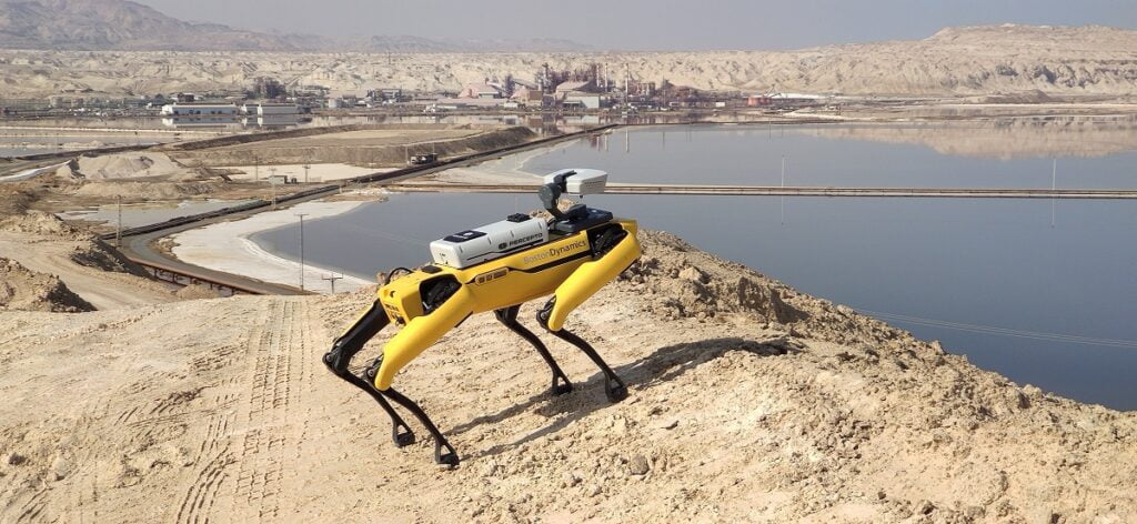 Percepto's Sparrow drone flies above Boston Dynamics' Spot robot. Courtesy