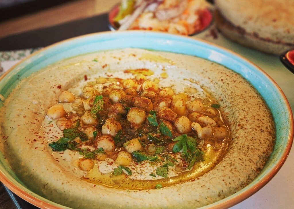 A plate of hummus. Photo by Alana Harris on Unsplash