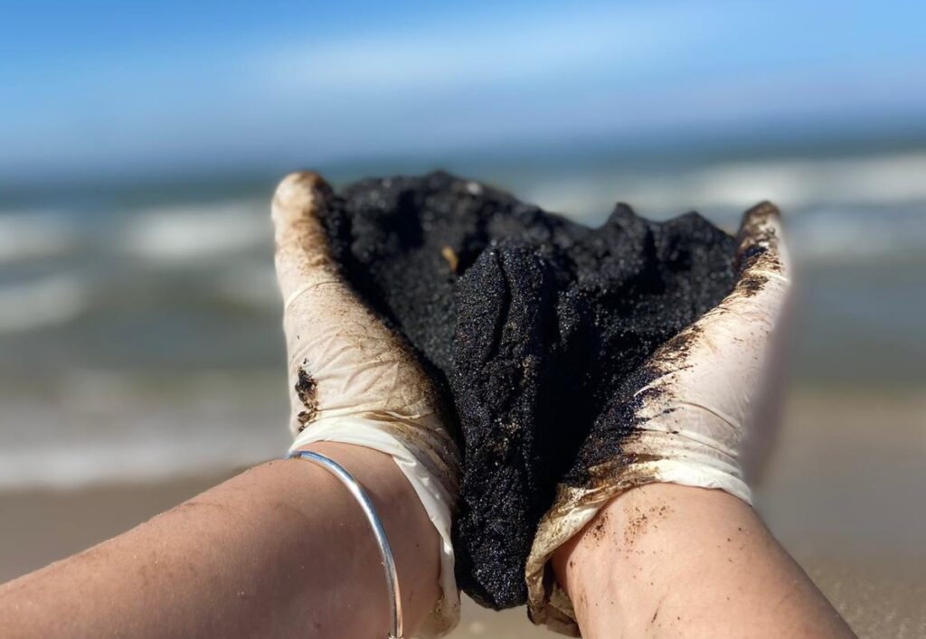 A lump of tar picked up by a volunteer cleaning up the beach near Nitzanim, 20 February 2021. Photo by Niv-ניב By ניב - Own work, CC BY-SA 4.0