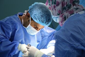 A surgical team performs an operation. Illustrative. Photo by JAFAR AHMED on Unsplash