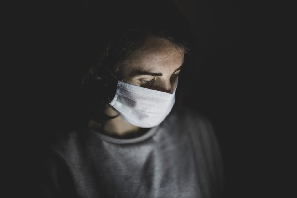 A masked woman. Illustrative. Photo by engin akyurt on Unsplash